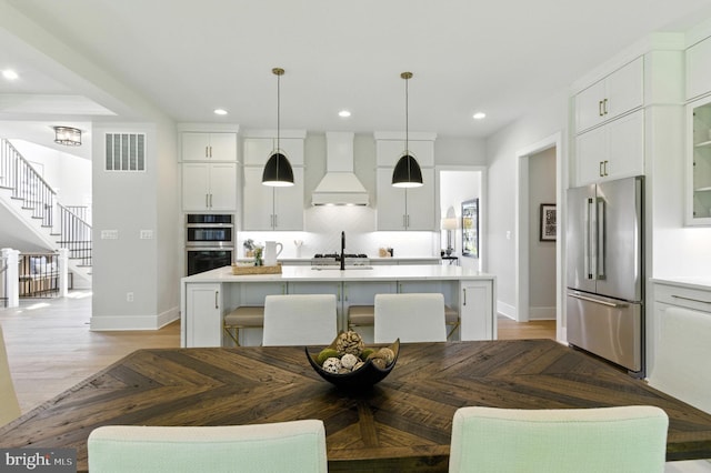 8202 Mockingbird Dr, Annandale, VA 22003 - dining space featuring recessed lighting, stairway, and light wood-type flooring