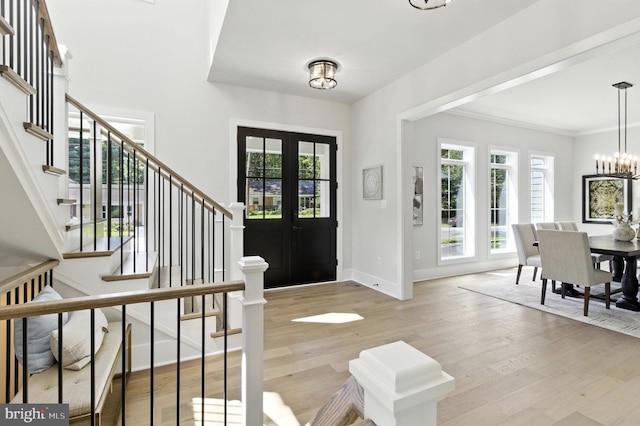 8202 Mockingbird Dr, Annandale, VA 22003 - entrance foyer with stairs, wood finished floors, a chandelier, and ornamental molding
