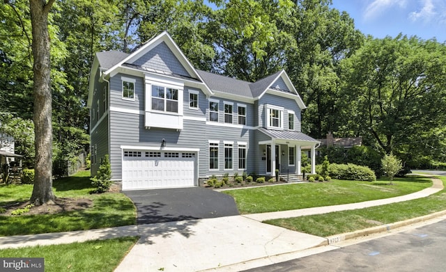 8202 Mockingbird Dr, Annandale, VA 22003 - view of front of house featuring asphalt driveway, an attached garage, a front lawn, a standing seam roof, and a metal roof