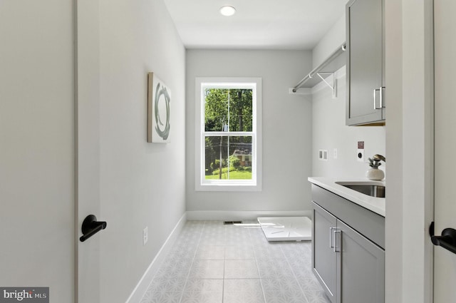 8202 Mockingbird Dr, Annandale, VA 22003 - laundry area with hookup for a washing machine, cabinet space, and light tile patterned flooring