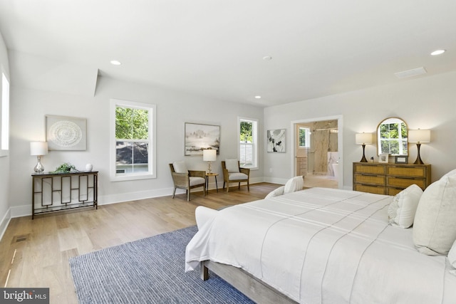 8202 Mockingbird Dr, Annandale, VA 22003 - bedroom with wood finished floors, multiple windows, recessed lighting, and ensuite bath