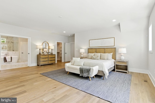 8202 Mockingbird Dr, Annandale, VA 22003 - bedroom featuring light wood-style floors, recessed lighting, connected bathroom, and a spacious closet