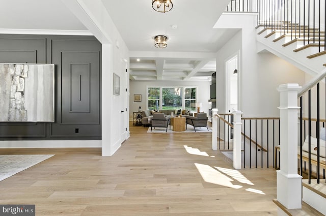 8202 Mockingbird Dr, Annandale, VA 22003 - foyer with coffered ceiling, light wood-style flooring, beamed ceiling, and stairs