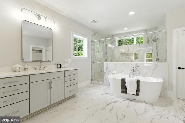 8202 Mockingbird Dr, Annandale, VA 22003 - bathroom featuring a marble finish shower, a freestanding bath, vanity, marble finish flooring, and recessed lighting