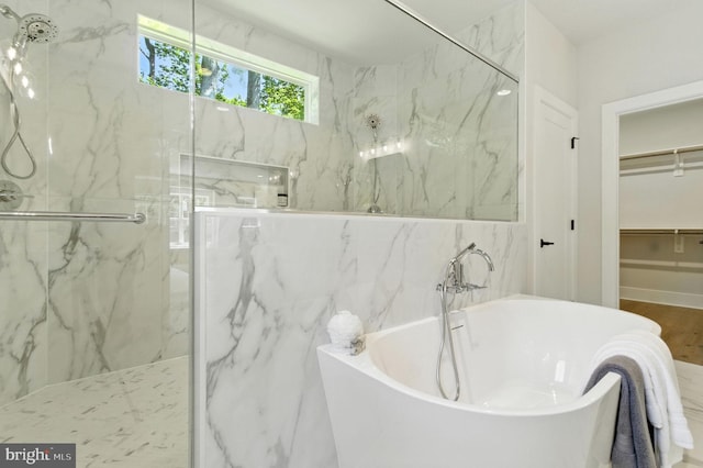 8202 Mockingbird Dr, Annandale, VA 22003 - bathroom with a marble finish shower, a soaking tub, and a walk in closet