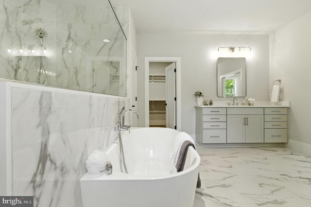 8202 Mockingbird Dr, Annandale, VA 22003 - bathroom with vanity, a spacious closet, a freestanding bath, and marble finish floors