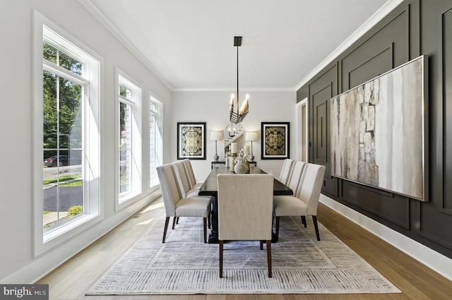 8202 Mockingbird Dr, Annandale, VA 22003 - dining area featuring ornamental molding, wood finished floors, and a chandelier