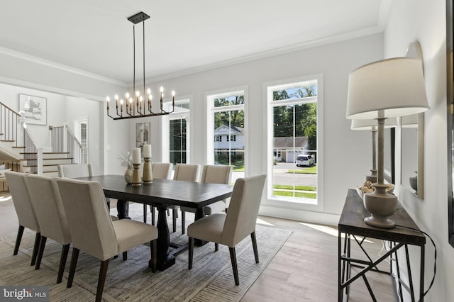 8202 Mockingbird Dr, Annandale, VA 22003 - dining space with a chandelier, crown molding, stairs, and light wood-type flooring