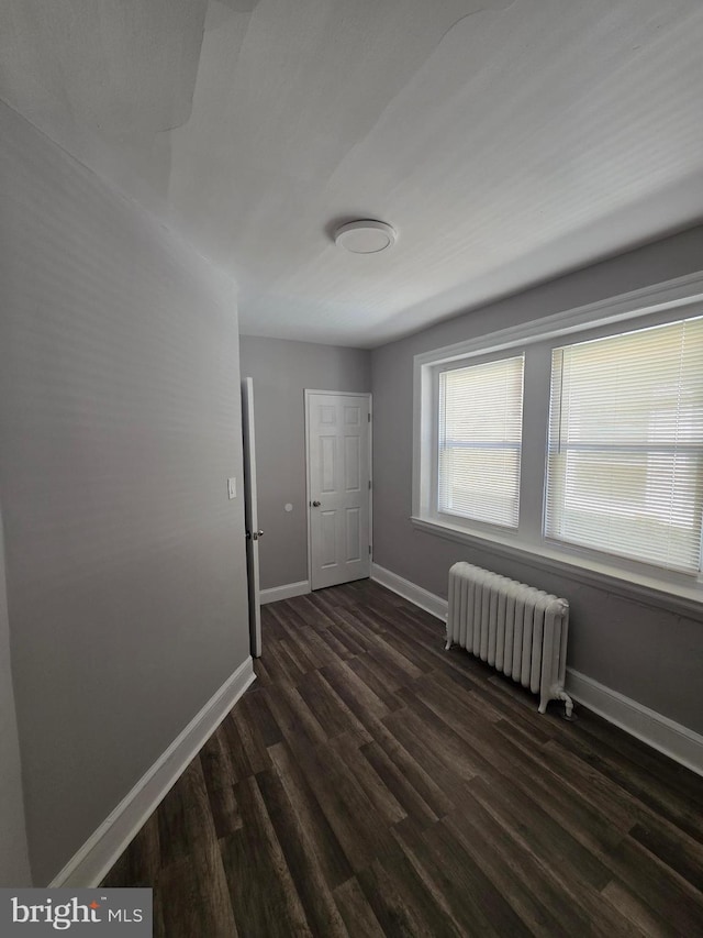 4735 Frankford Ave, Philadelphia, PA 19124 - empty room featuring radiator and dark wood-style floors
