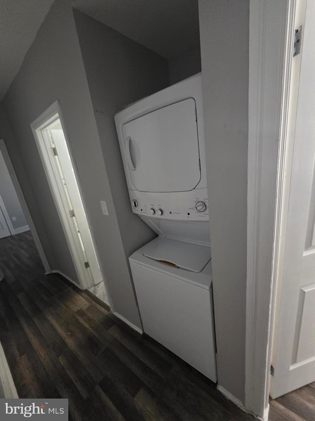 4735 Frankford Ave, Philadelphia, PA 19124 - laundry area with stacked washer / dryer and dark wood-type flooring