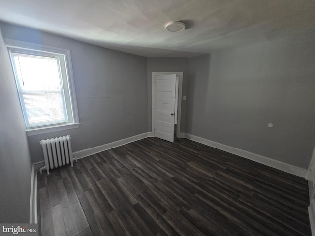 4735 Frankford Ave, Philadelphia, PA 19124 - unfurnished room with radiator and dark wood finished floors