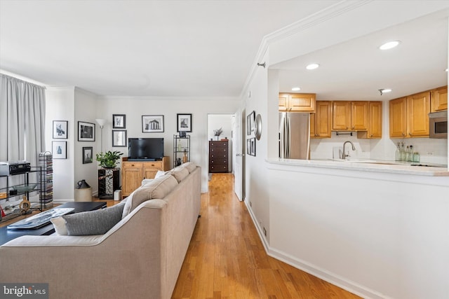 2001 Hamilton St Unit 1205, Philadelphia, PA 19130 - living area with crown molding, light wood-style floors, and recessed lighting