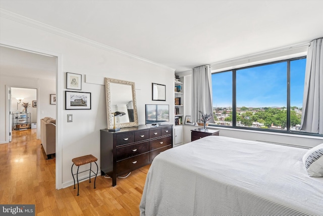 2001 Hamilton St Unit 1205, Philadelphia, PA 19130 - bedroom with light wood-style flooring and crown molding