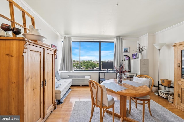 2001 Hamilton St Unit 1205, Philadelphia, PA 19130 - dining room featuring crown molding, light wood finished floors, and a wall mounted AC