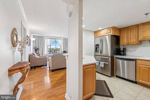 2001 Hamilton St Unit 1205, Philadelphia, PA 19130 - kitchen featuring appliances with stainless steel finishes, light countertops, tasteful backsplash, open floor plan, and recessed lighting