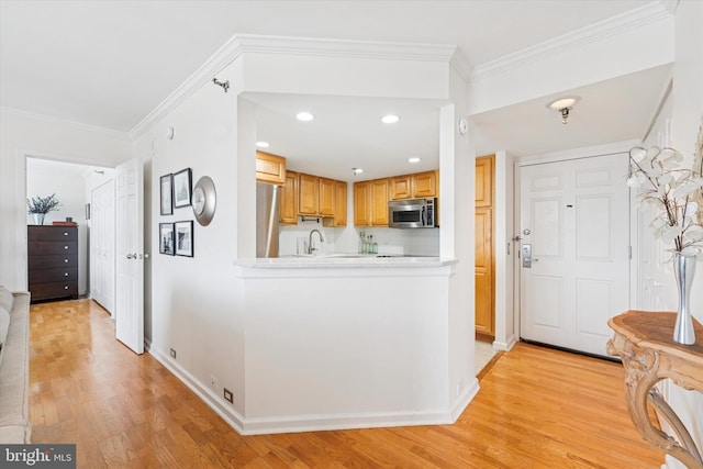 2001 Hamilton St Unit 1205, Philadelphia, PA 19130 - entryway featuring light wood finished floors, crown molding, and recessed lighting