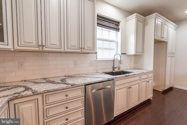 4251 Beech Dr, Nazareth, PA 18064 - kitchen with stainless steel dishwasher, cream cabinets, dark wood finished floors, and light stone countertops