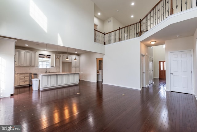 4251 Beech Dr, Nazareth, PA 18064 - unfurnished living room featuring a towering ceiling, dark wood-style flooring, and recessed lighting