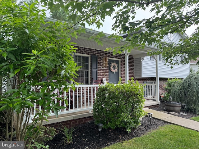 408 Lexington Way, Littlestown, PA 17340 - view of front of house featuring covered porch and brick siding