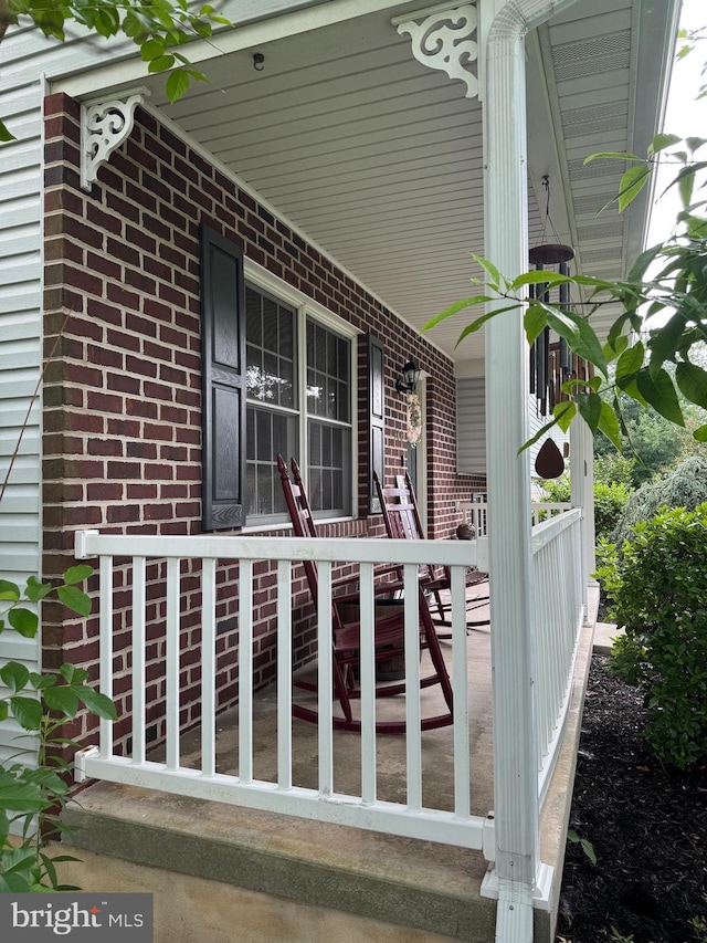 408 Lexington Way, Littlestown, PA 17340 - view of property exterior with covered porch and brick siding