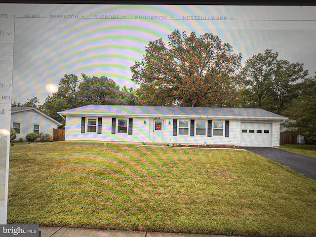4105 Sunburst Ct, Alexandria, VA 22303 - ranch-style house with a yard, asphalt driveway, and an attached garage