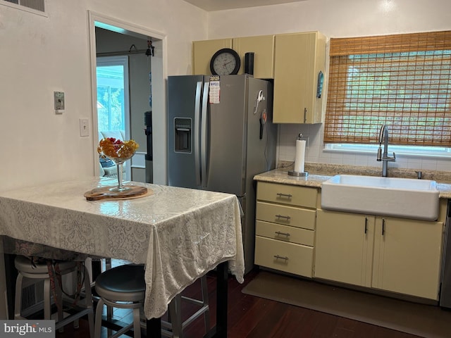4105 Sunburst Ct, Alexandria, VA 22303 - kitchen featuring stainless steel fridge with ice dispenser, dark wood-style flooring, healthy amount of natural light, and tasteful backsplash