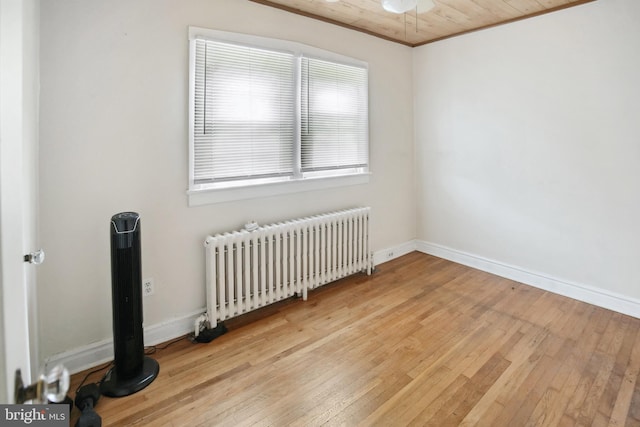 1711 W Union Blvd, Bethlehem, PA 18018 - unfurnished room with radiator heating unit, light wood-style floors, and wood ceiling