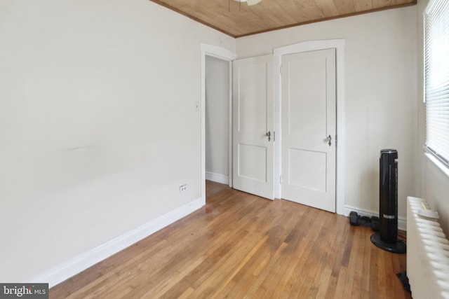 1711 W Union Blvd, Bethlehem, PA 18018 - unfurnished bedroom with radiator heating unit, light wood-type flooring, crown molding, and wood ceiling