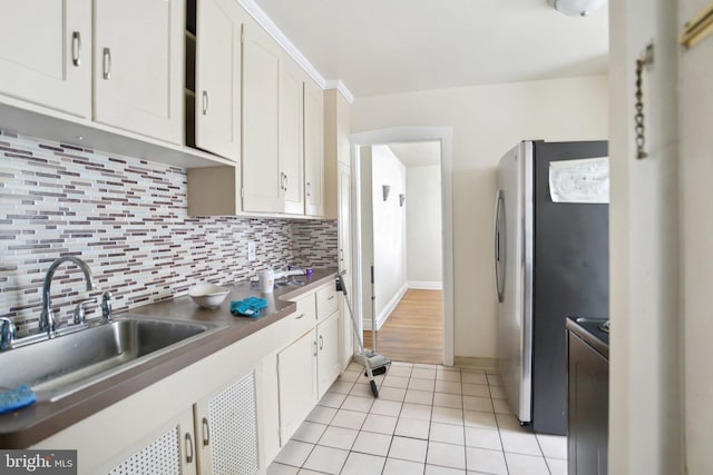 1711 W Union Blvd, Bethlehem, PA 18018 - kitchen with freestanding refrigerator, backsplash, and white cabinetry