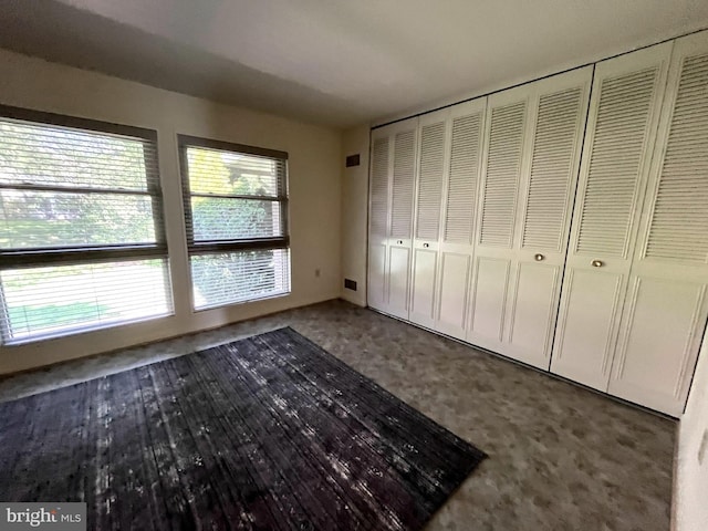 3445 S Leisure World Blvd Unit 87-2C, Silver Spring, MD 20906 - unfurnished bedroom featuring carpet and a closet