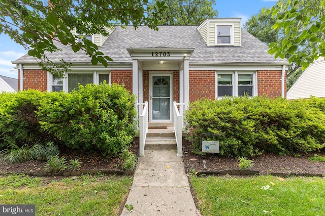 12703 Bluhill Rd, Silver Spring, MD 20906 - view of front of home featuring brick siding and roof with shingles