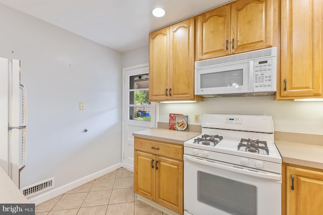 12703 Bluhill Rd, Silver Spring, MD 20906 - kitchen with white appliances, light countertops, and light tile patterned floors