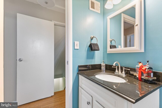 12703 Bluhill Rd, Silver Spring, MD 20906 - bathroom featuring vanity and wood finished floors