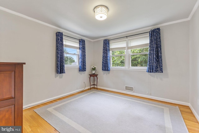 12703 Bluhill Rd, Silver Spring, MD 20906 - unfurnished room featuring light wood-style flooring and ornamental molding
