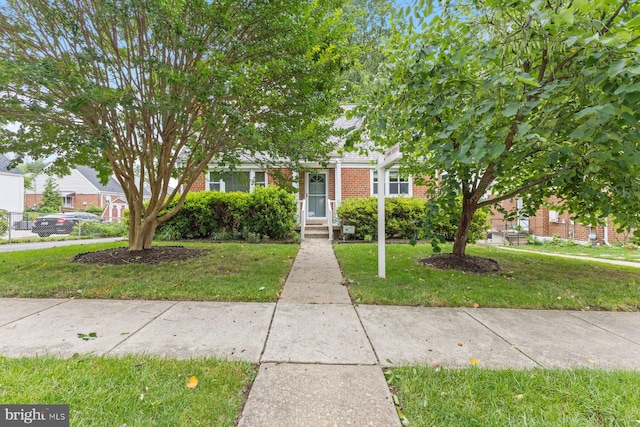 12703 Bluhill Rd, Silver Spring, MD 20906 - view of property hidden behind natural elements featuring brick siding and a front lawn