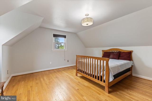 12703 Bluhill Rd, Silver Spring, MD 20906 - bedroom featuring wood finished floors and vaulted ceiling