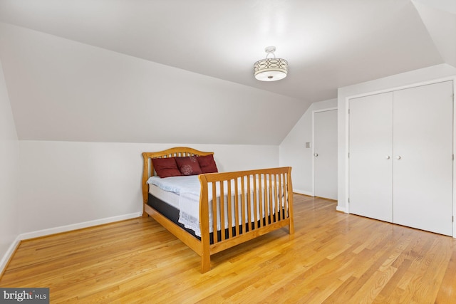 12703 Bluhill Rd, Silver Spring, MD 20906 - bedroom featuring vaulted ceiling, wood finished floors, and a closet