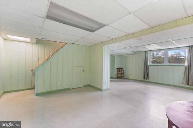 12703 Bluhill Rd, Silver Spring, MD 20906 - basement featuring tile patterned floors, a paneled ceiling, and stairway