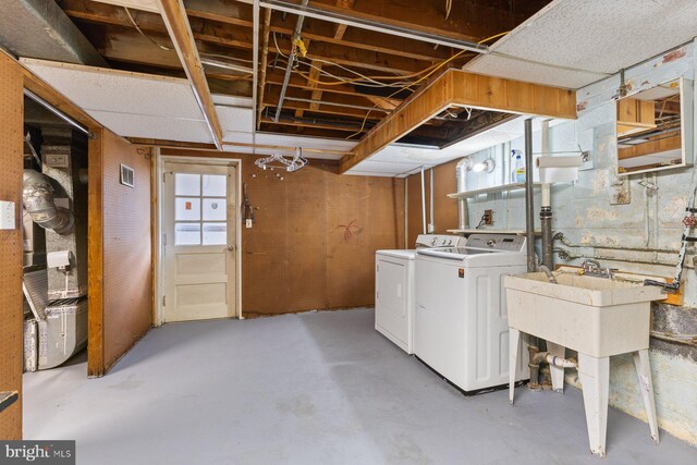 12703 Bluhill Rd, Silver Spring, MD 20906 - basement with washer and clothes dryer