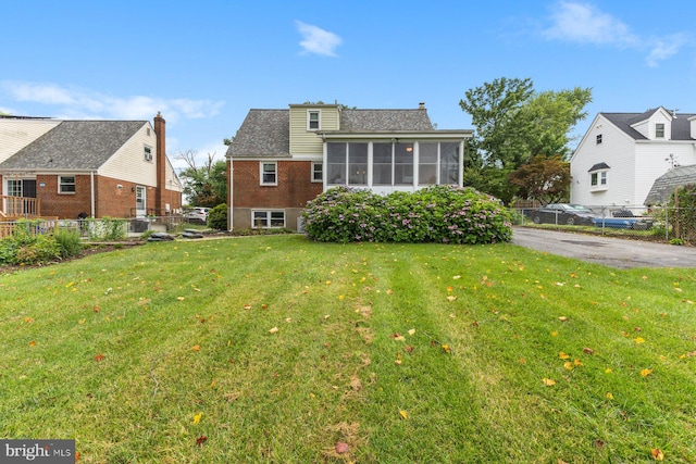 12703 Bluhill Rd, Silver Spring, MD 20906 - rear view of property with a sunroom and brick siding