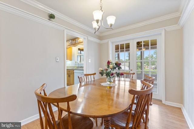 12703 Bluhill Rd, Silver Spring, MD 20906 - dining room featuring a chandelier, light wood finished floors, and ornamental molding