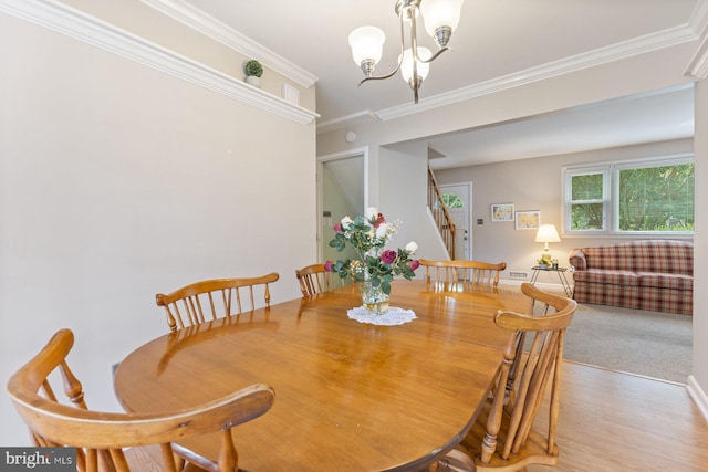 12703 Bluhill Rd, Silver Spring, MD 20906 - dining room featuring stairway, ornamental molding, a chandelier, and light wood-style flooring