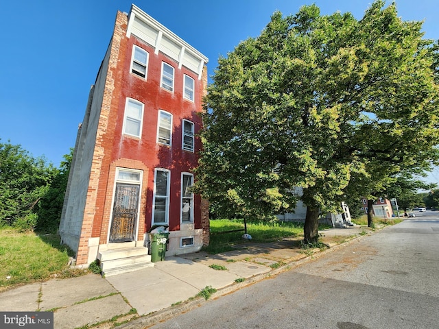 708 N Mount St, Baltimore, MD 21217 - view of property featuring brick siding and entry steps