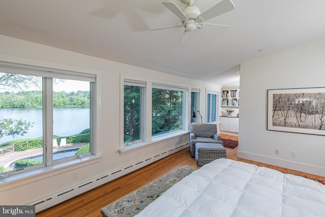 697 Prospect Ave, Princeton, NJ 08540 - bedroom with multiple windows, a baseboard heating unit, vaulted ceiling, wood finished floors, and a water view