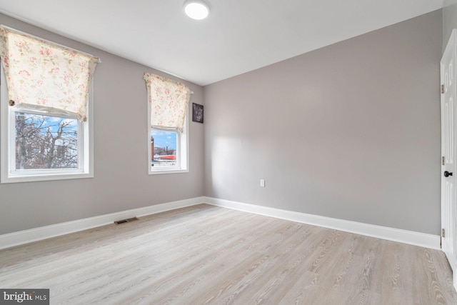 1539 N Payson St, Baltimore, MD 21217 - empty room with light wood-style flooring and baseboards