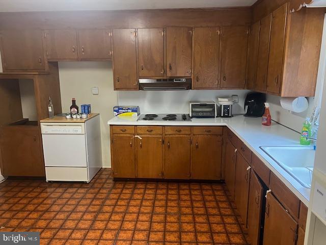 60 Buckwalter Rd, Royersford, PA 19468 - kitchen featuring white dishwasher, under cabinet range hood, light countertops, and black electric cooktop