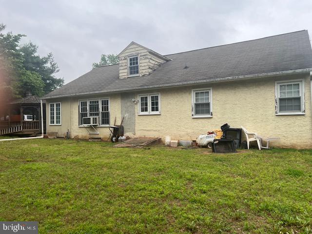 60 Buckwalter Rd, Royersford, PA 19468 - rear view of property featuring stucco siding and a yard