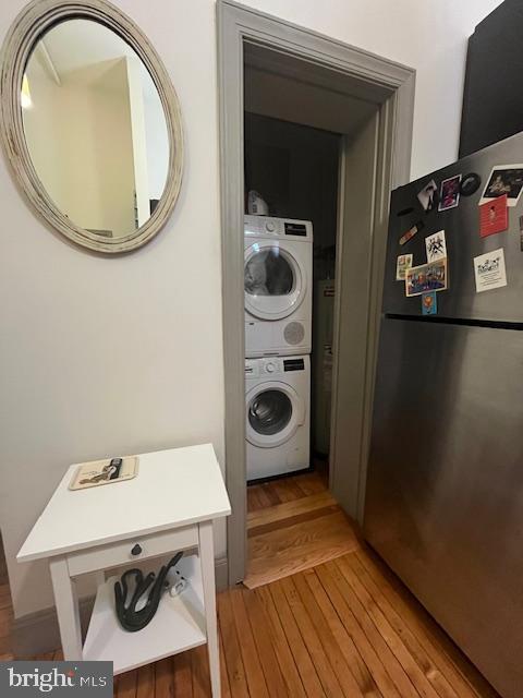 511 S Bond St Unit 304, Baltimore, MD 21231 - laundry room with stacked washer / drying machine and light wood finished floors