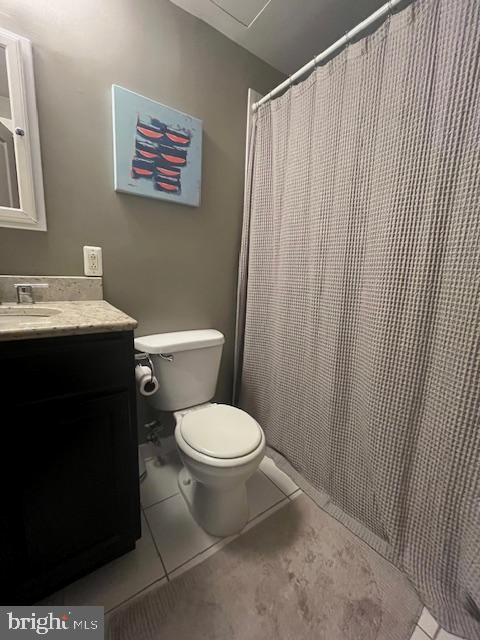 511 S Bond St Unit 304, Baltimore, MD 21231 - bathroom featuring vanity, tile patterned flooring, and a shower with curtain