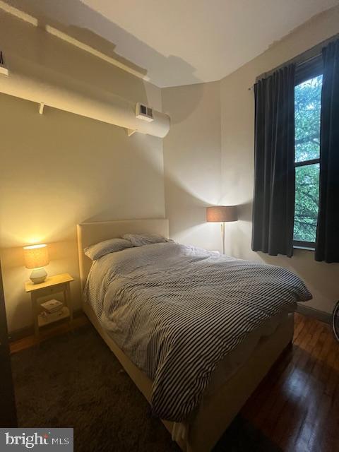 511 S Bond St Unit 304, Baltimore, MD 21231 - bedroom featuring wood finished floors and baseboards